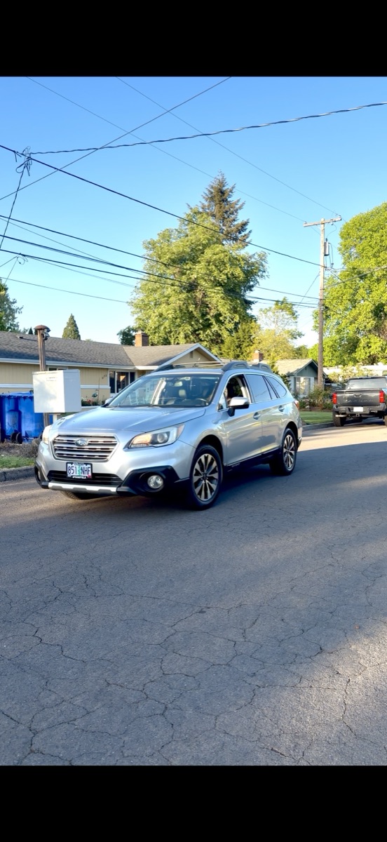 Silver Subaru Outback after detail, bright reflective paint