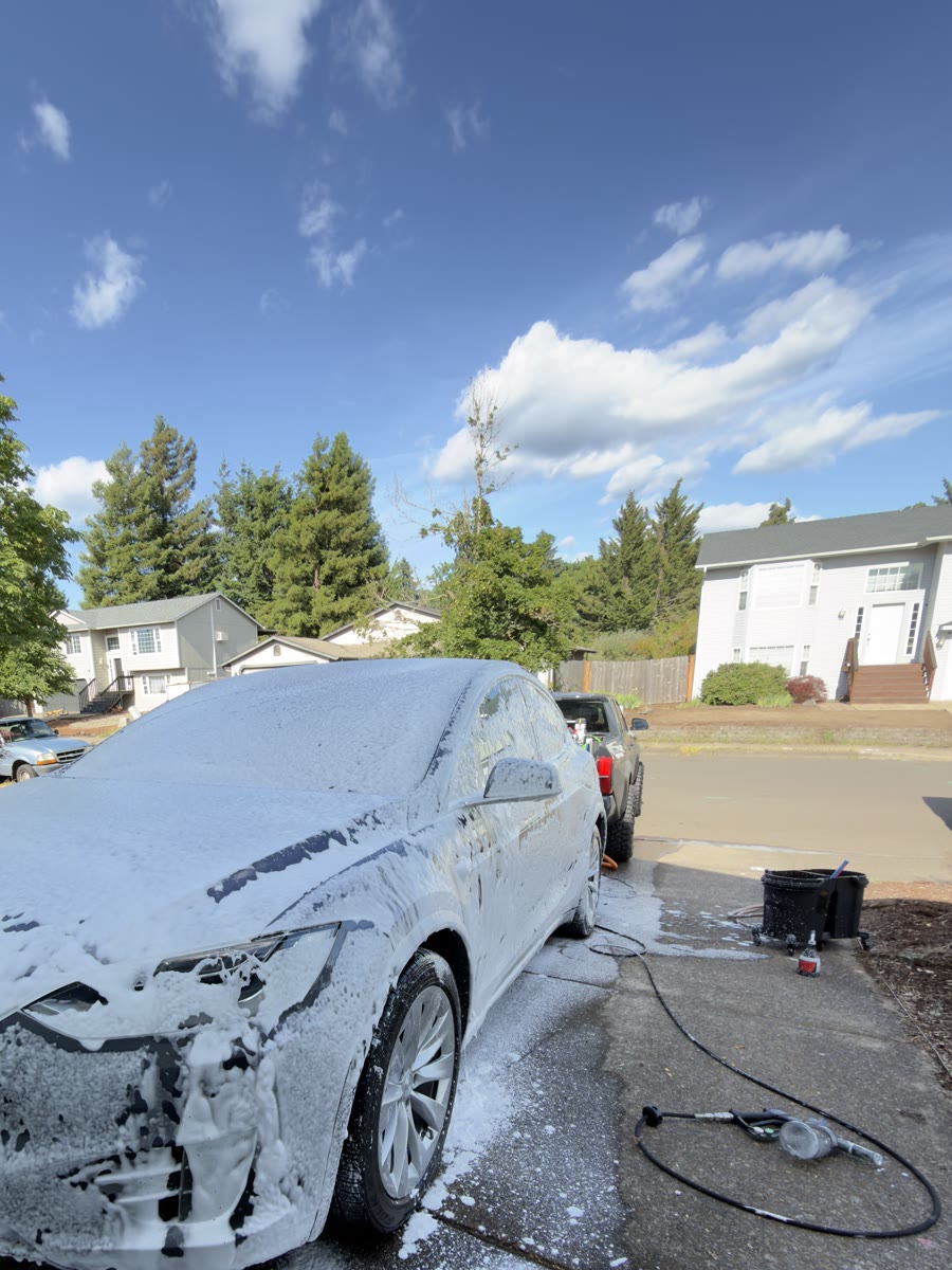 Tesla covered in thick foam mid-wash for Bearfish Media